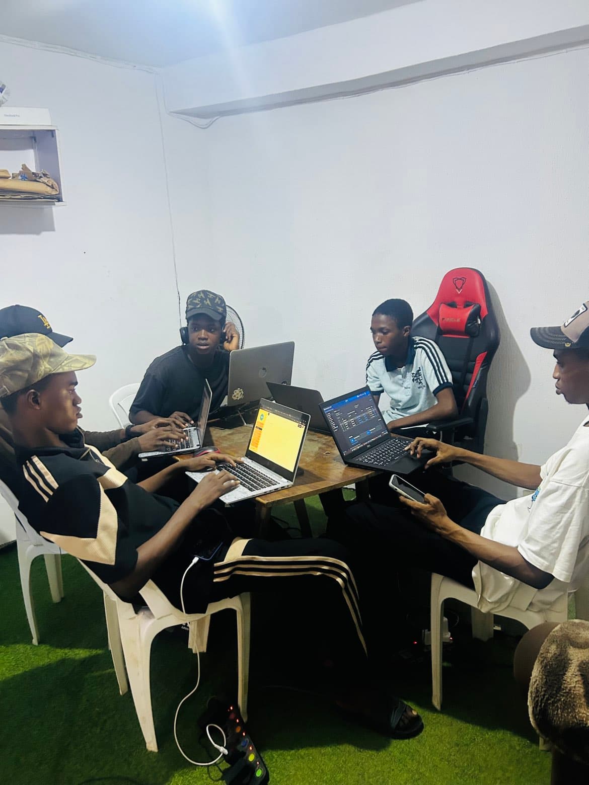 A group of students working on laptops